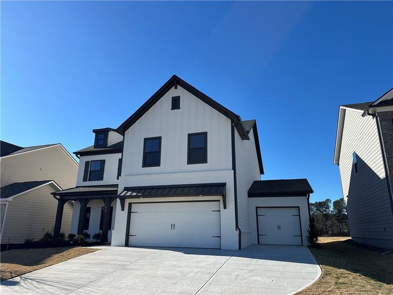 Front exterior of a new home in Summerlin, Winder, GA, highlighting curb appeal (Image 21).