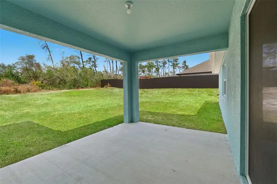 Exterior details and patio area of a home in , Spring Hill (Image 3).