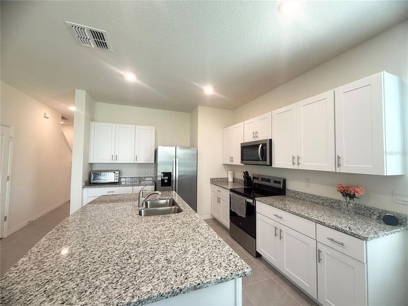 Furnished interior view inside a new home in , Kissimmee (Image 8).