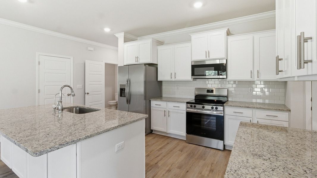 Representative furnished interior of a home built from the The Belfort by D.R. Horton in Greystone, Crawfordville (Image 8).