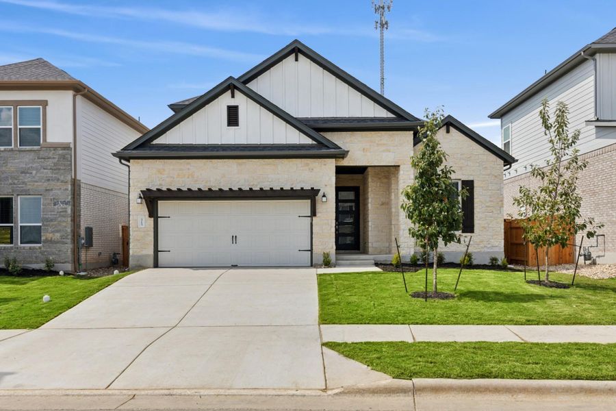 Front exterior of a new home in Edgewood, Leander, TX, highlighting curb appeal (Image 19).