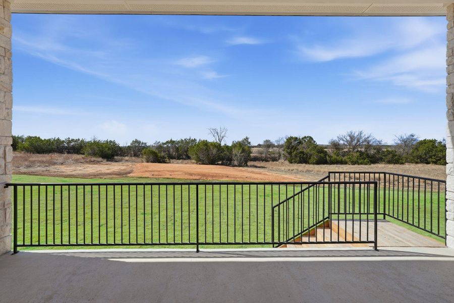 Balcony featuring a view of countryside
