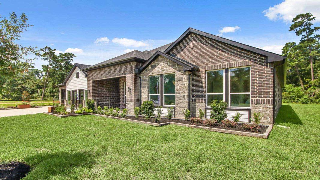 Front exterior of a new home in Butlers Bend Estates, Pinehurst, TX, highlighting curb appeal (Image 25).