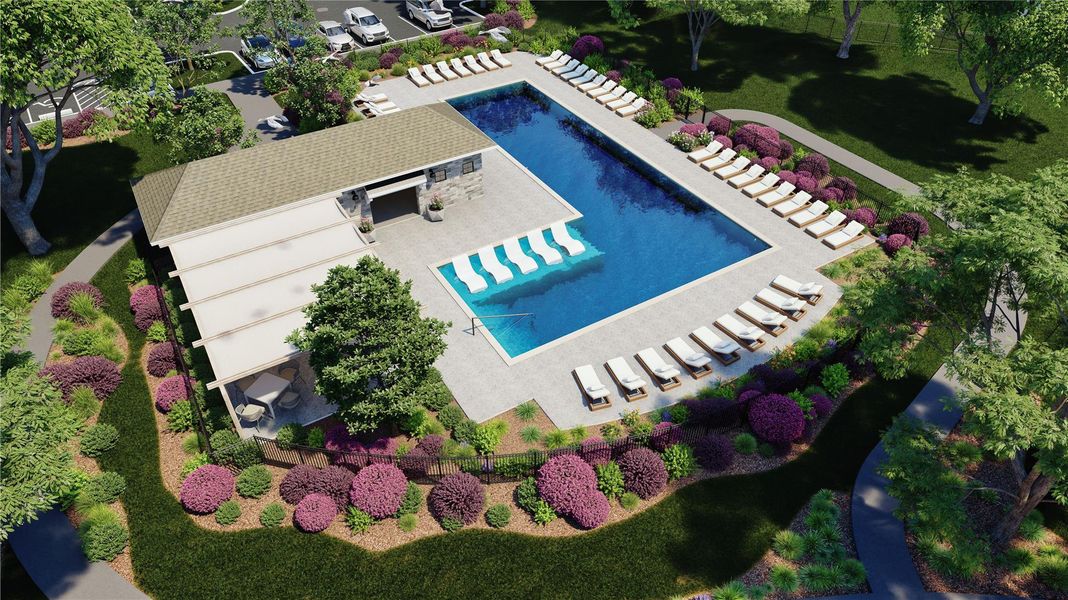 Community pool with a lawn and a patio area Community pool with a lawn and a patio area