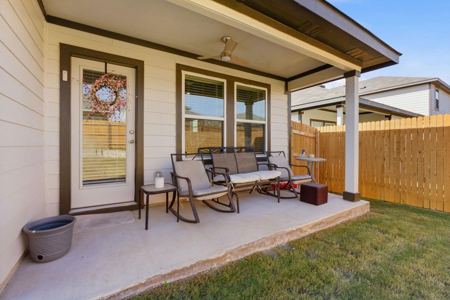 View of patio featuring ceiling fan