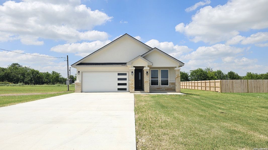 Front exterior of a new home in , Atascosa, TX, highlighting curb appeal (Image 26).