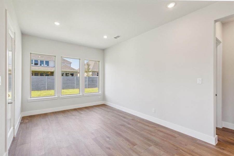 Unfurnished room featuring light hardwood / wood-style floors