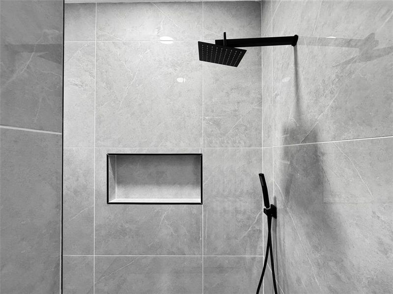 Bathroom view of a tile shower