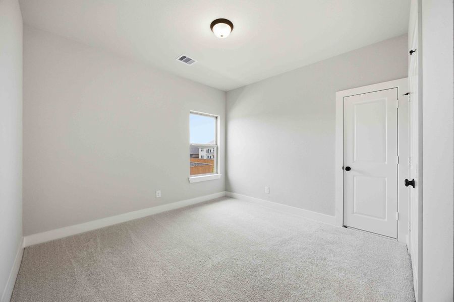 Spacious, unfurnished interior of a new home in Sunterra 50s, Katy (Image 37).