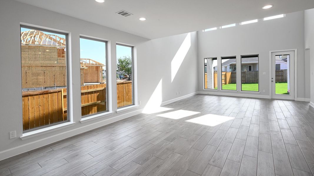 Spare room featuring recessed lighting and wood finished floors