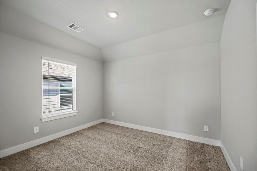 Three spacious secondary bedrooms upstairs, each with large closets and cozy carpet underfoot.