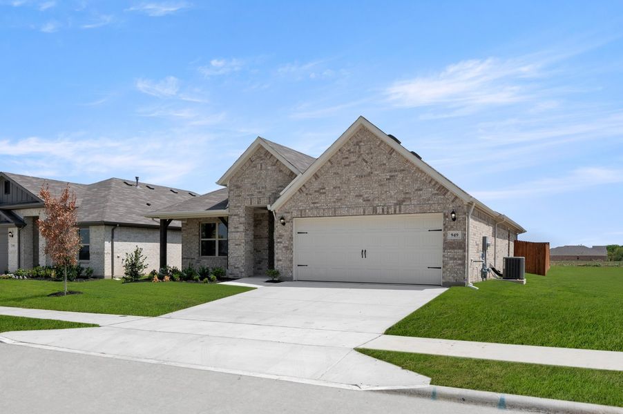 Front exterior of a new home in Terra Vella, Haslet, TX, highlighting curb appeal (Image 2). Front exterior of a new home in Terra Vella, Haslet, TX, highlighting curb appeal (Image 2).