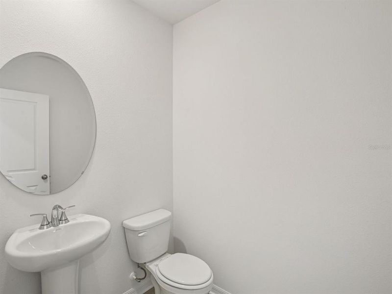 Furnished interior view inside a new home in The Grove at Stuart Crossing - Classic Series, Bartow (Image 13).