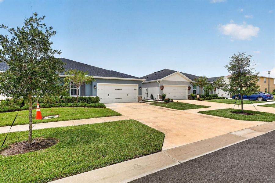 Front exterior of a new home in , Port St. Lucie, FL, highlighting curb appeal (Image 26). Front exterior of a new home in , Port St. Lucie, FL, highlighting curb appeal (Image 26).