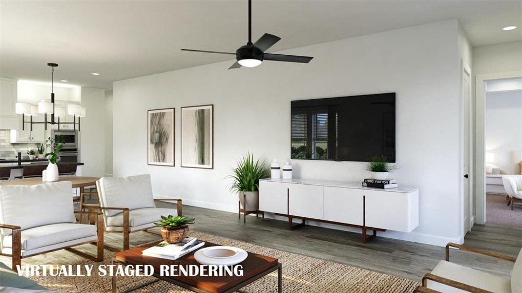 With family room open to the kitchen-dining area, this home was designed for entertaining!  VIRTUALLY STAGED RENDERING