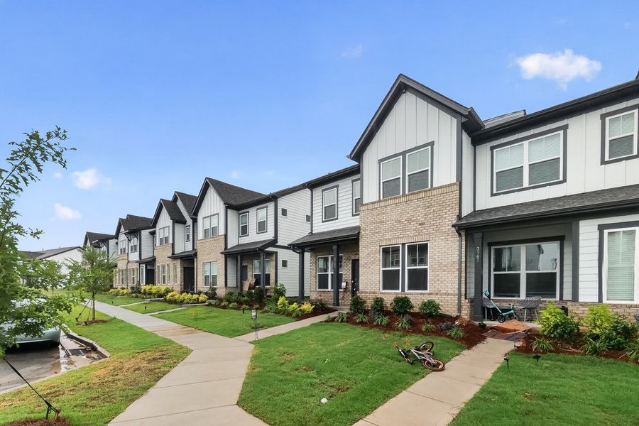 Front exterior of a new home in Ridge at Sugar Creek, Indian Land, SC, highlighting curb appeal (Image 18). Front exterior of a new home in Ridge at Sugar Creek, Indian Land, SC, highlighting curb appeal (Image 18).