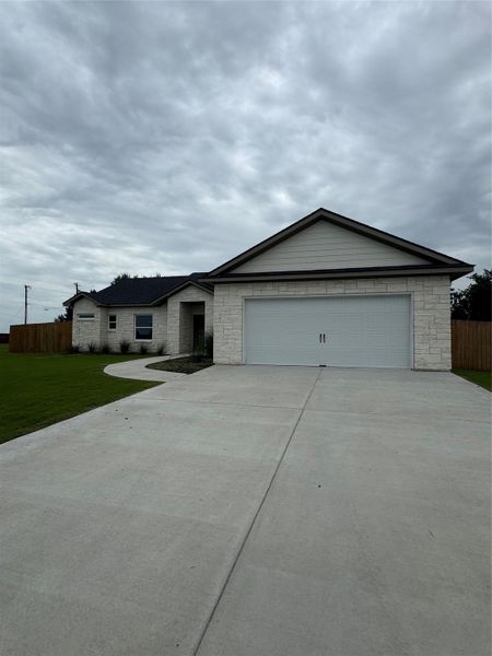 Front exterior of a new home in , Thorndale, TX, highlighting curb appeal (Image 20).