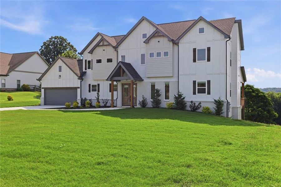 Front exterior of a new home in , Clermont, GA, highlighting curb appeal (Image 2).