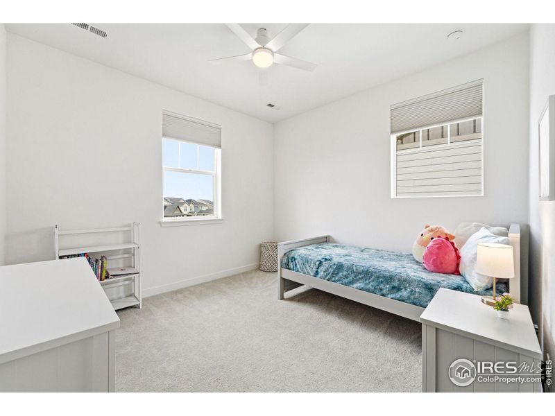 Additional bedroom (bedroom 4) with bright windows and adaptable layout.