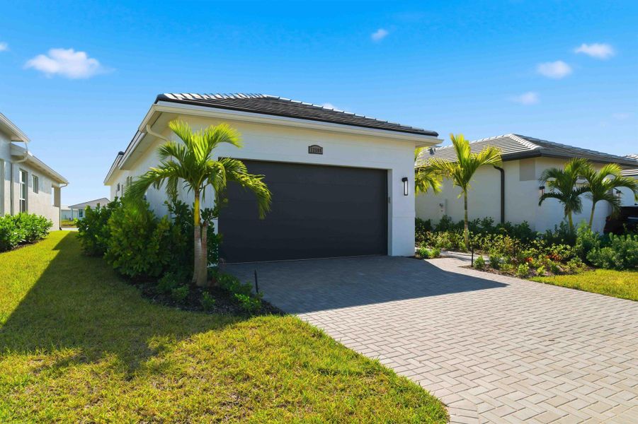 Front exterior of a new home in , Port St. Lucie, FL, highlighting curb appeal (Image 26).