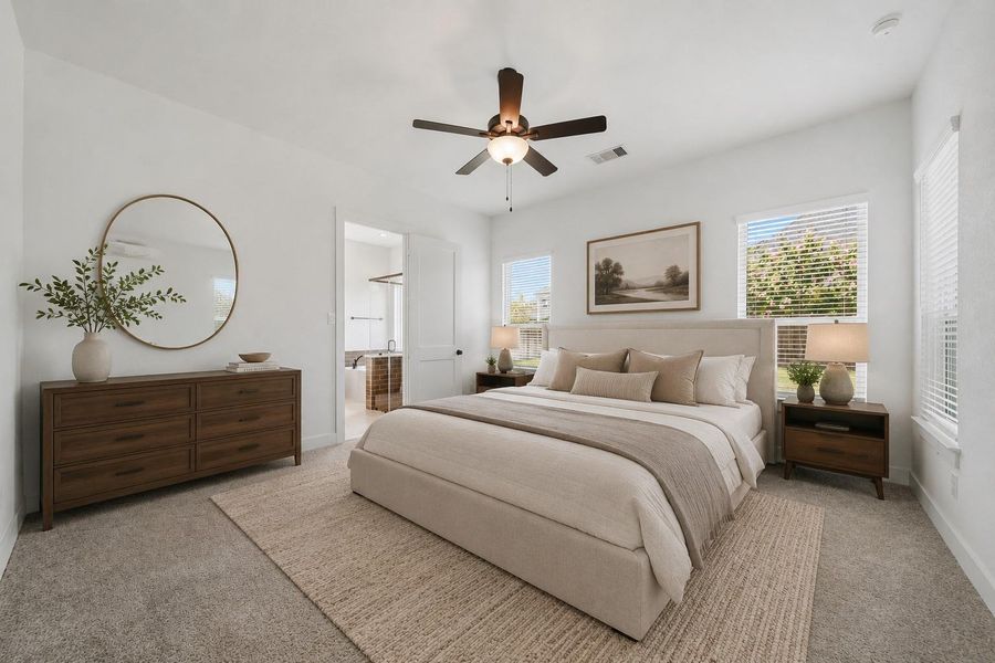 The primary bedroom welcomes you with bright natural light and the perfect view of the serene yard. It sits at the back of the home offering additional privacy and easily fits a king size bed plus furniture! *This photo has been virtually staged