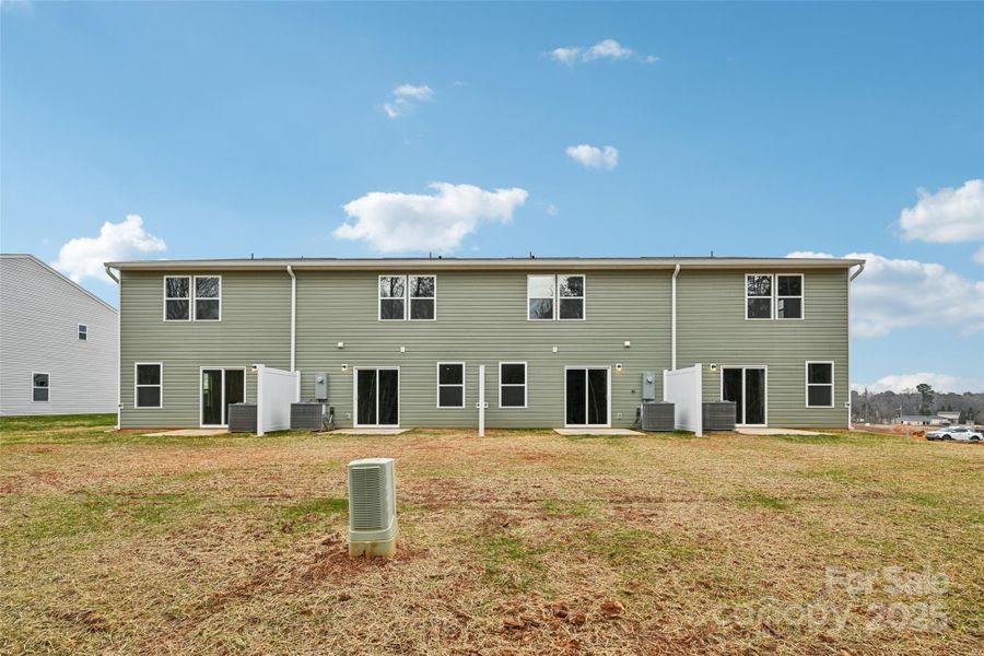 Exterior details and patio area of a home in The Towns at Green Needles, Lexington (Image 12).