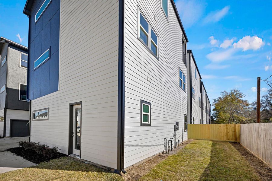 Every home includes its own fenced yard, creating a private outdoor area while maintaining the convenience of community living.