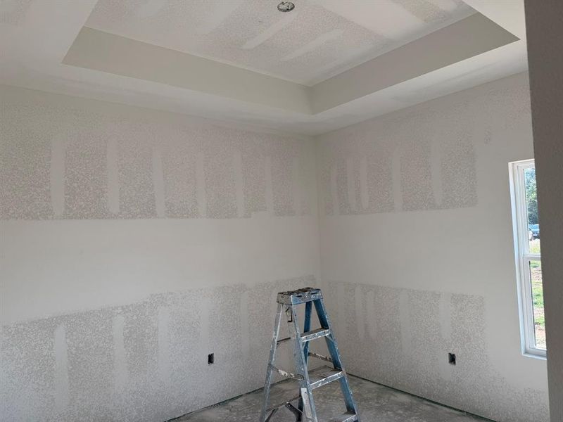 Empty room with a raised ceiling
