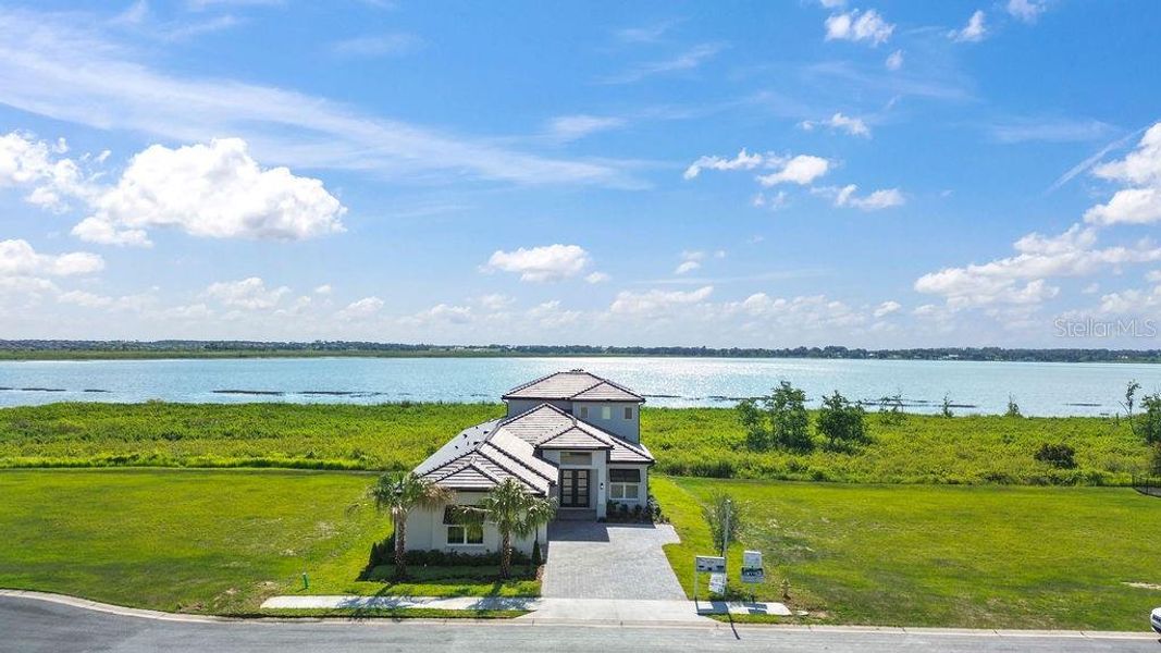 Front exterior of a new home in , Lake Alfred, FL, highlighting curb appeal (Image 24).