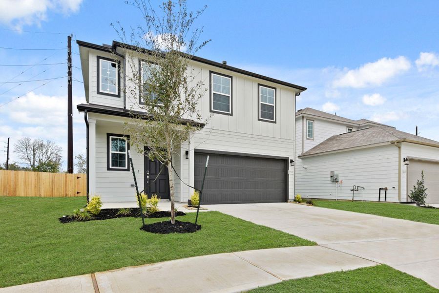 Front exterior of a new home in Barrett Crossing, Crosby, TX, highlighting curb appeal (Image 17).