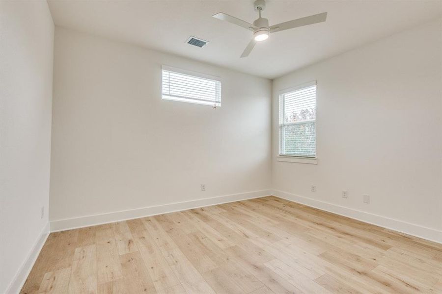 Unfurnished room with light wood-type flooring