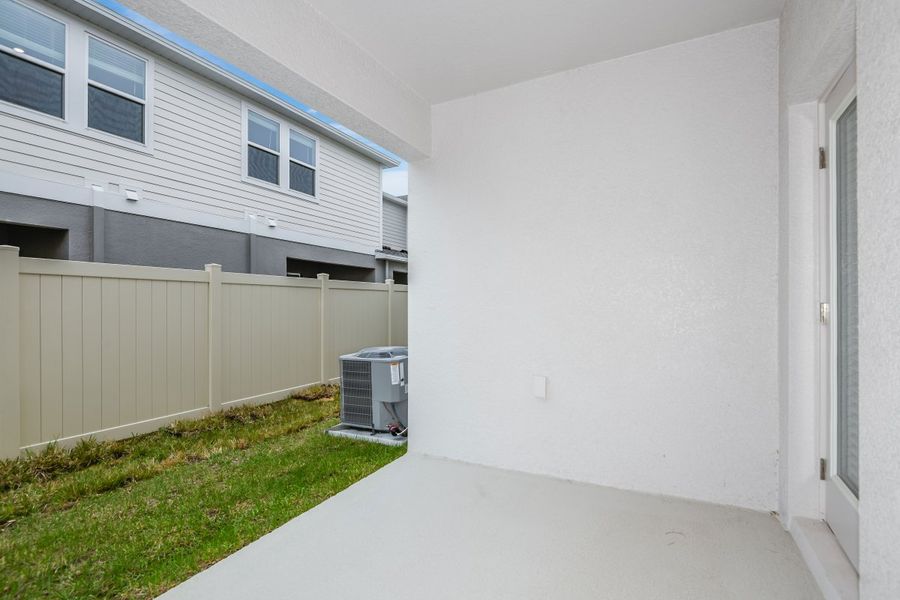 Exterior details and patio area of a home in Pasadena Woods, Dade City (Image 3).