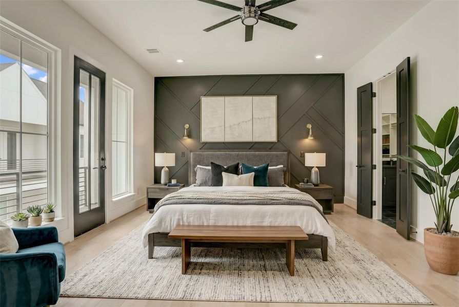 The primary suite sits on the third floor and offers a spa-like retreat. Virtually staged photo.