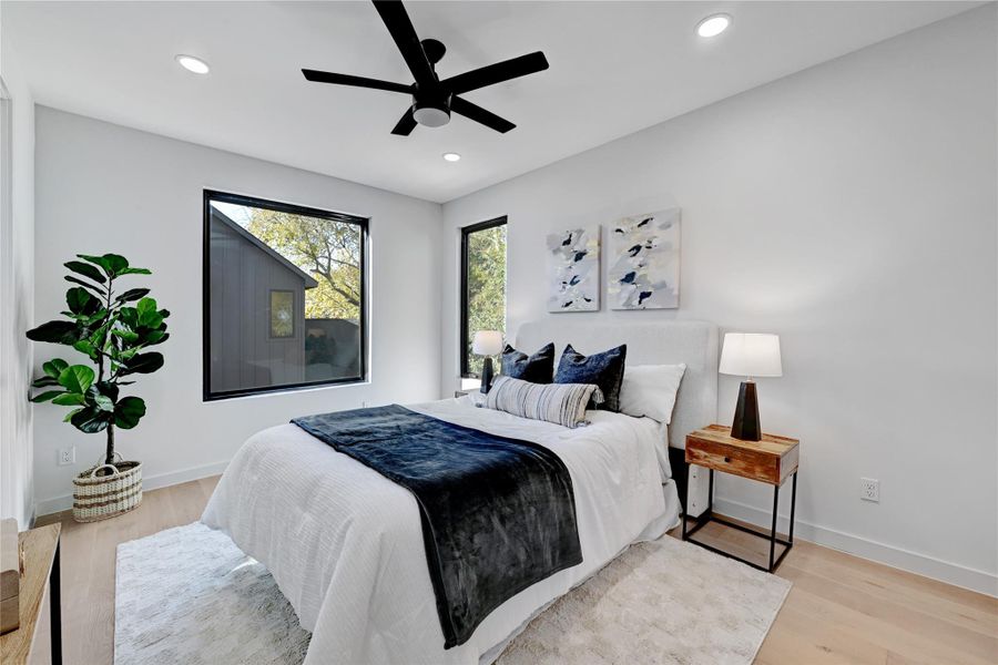 Bedroom with recessed lighting, baseboards, and wood finished floors