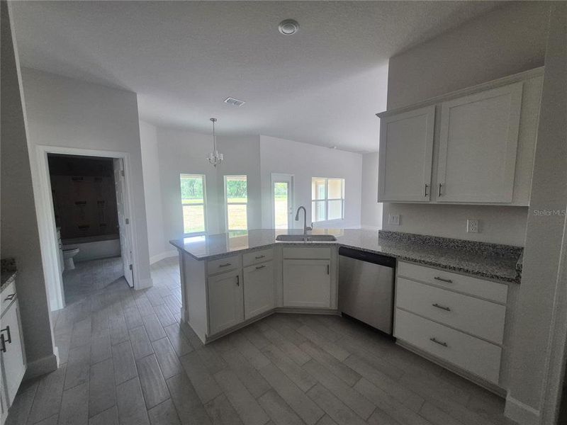 Furnished interior view inside a new home in Hill Country Estates, Dade City (Image 12).