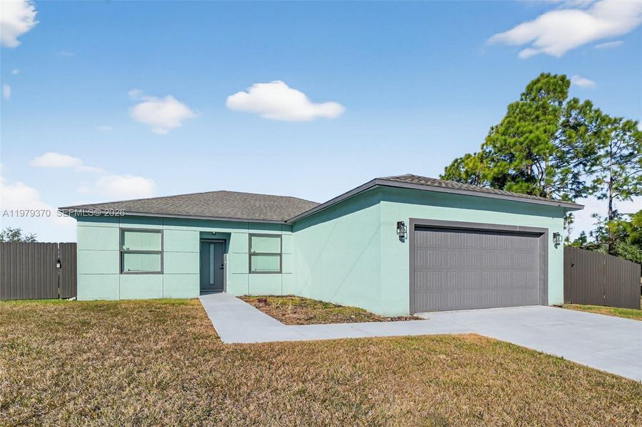 Front exterior of a new home in , Lehigh Acres, FL, highlighting curb appeal (Image 1). Front exterior of a new home in , Lehigh Acres, FL, highlighting curb appeal (Image 1).