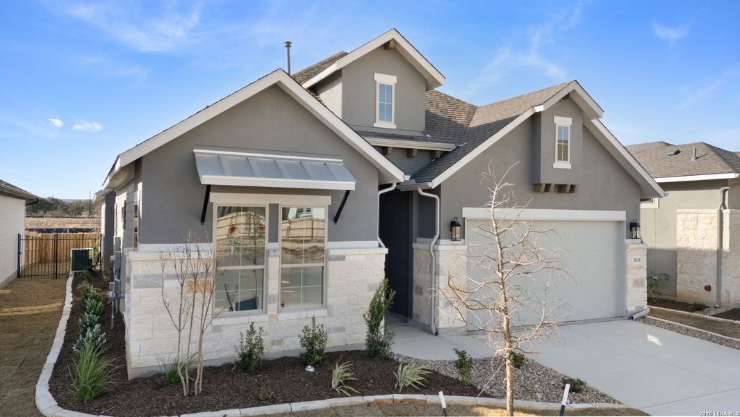 Front exterior of a new home in Davis Ranch, San Antonio, TX, highlighting curb appeal (Image 2).