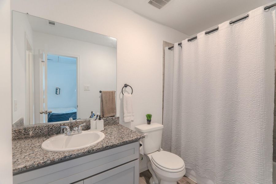 Full bathroom upstairs with updated finishes and modern style Full bathroom upstairs with updated finishes and modern style