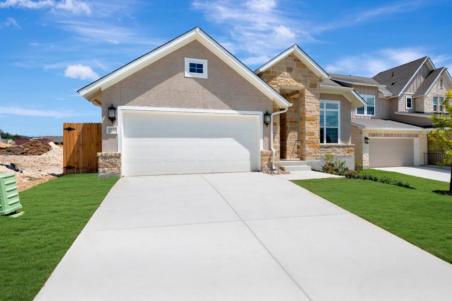 Front exterior of a new home in Davis Ranch 50', San Antonio, TX, highlighting curb appeal (Image 2). Front exterior of a new home in Davis Ranch 50', San Antonio, TX, highlighting curb appeal (Image 2).
