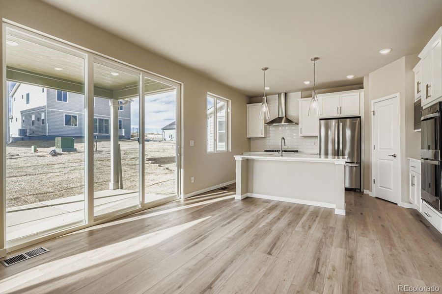 GOURMET KITCHEN AND DINING AREA