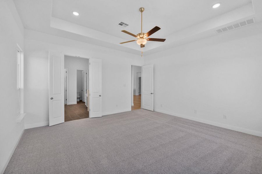 Primary Bedroom with tray ceiling