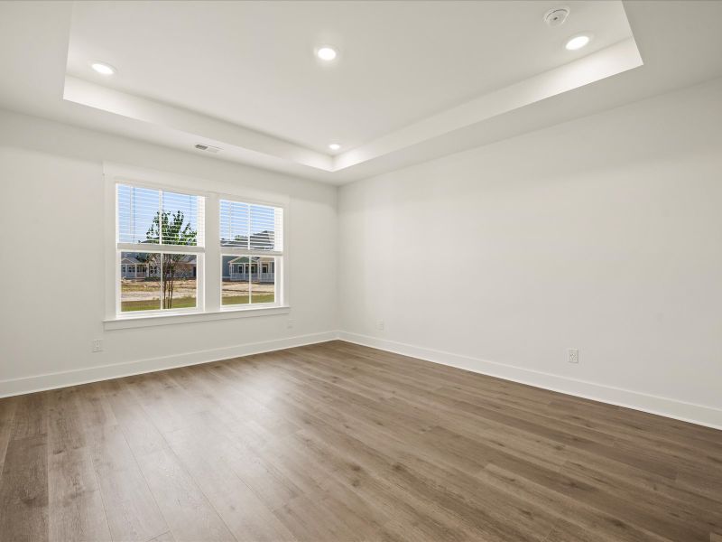 Spacious, unfurnished interior of a new home in The Coves at Lakes of Cane Bay, Summerville (Image 21).