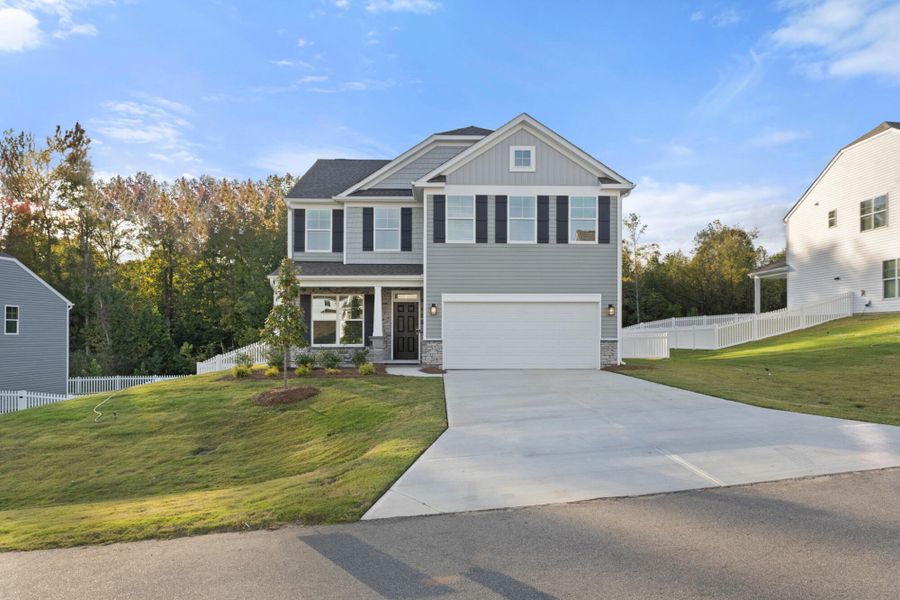 Front exterior of a new home in Cottages at Piper Village, Trinity, NC, highlighting curb appeal (Image 2).