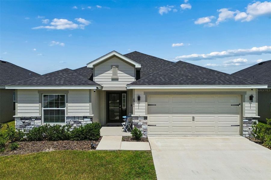 Front exterior of a new home in , Zephyrhills, FL, highlighting curb appeal (Image 27).