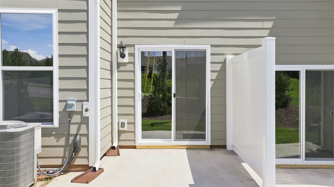 Exterior details and patio area of a home in Townes at Tap Root Farms, Fletcher (Image 2). Exterior details and patio area of a home in Townes at Tap Root Farms, Fletcher (Image 2).