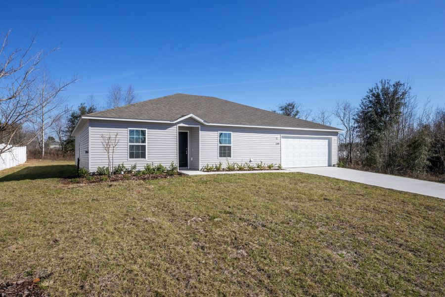 Representative exterior photo of a completed home built from the Iris by Maronda Homes in Royal Highlands, Weeki Wachee, FL (Image 28).