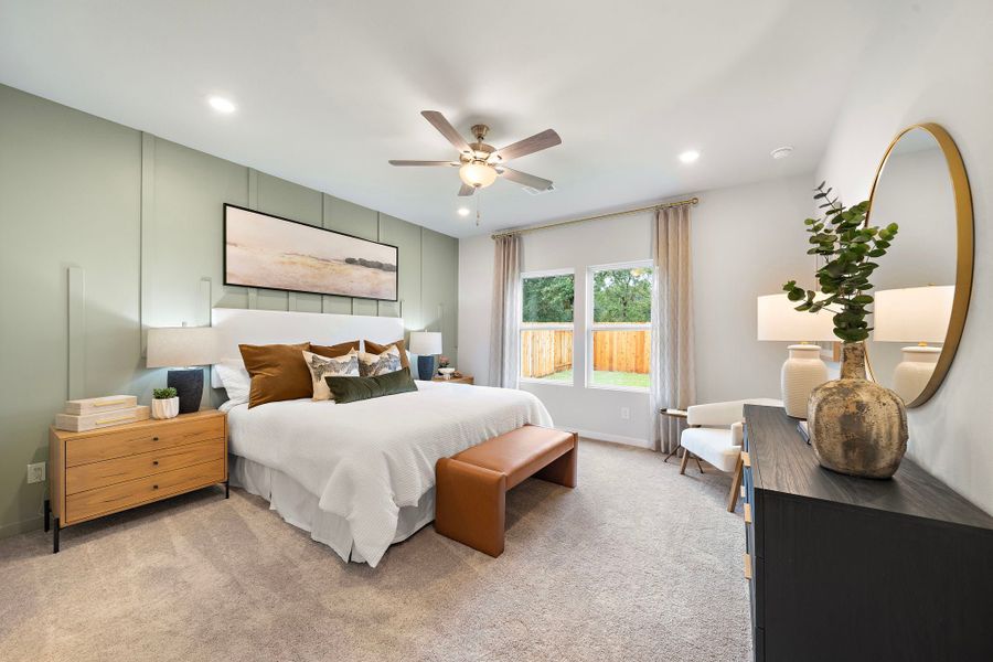 A bedroom with a large bed and a large mirror. A bedroom with a large bed and a large mirror.