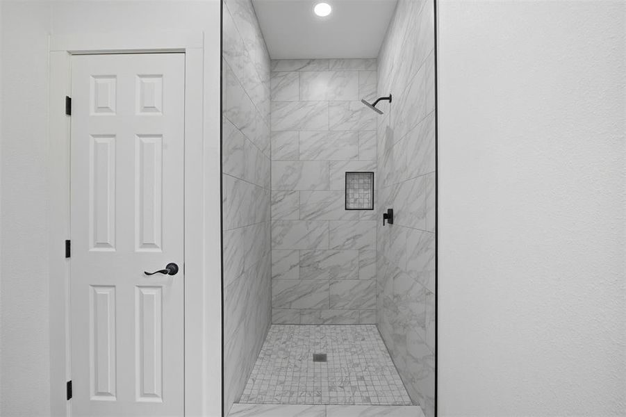 Bathroom with a shower stall Bathroom with a shower stall