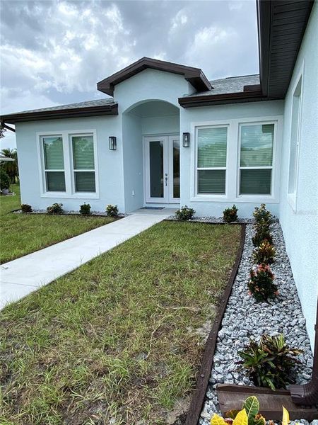 Front exterior of a new home in , Punta Gorda, FL, highlighting curb appeal (Image 2).