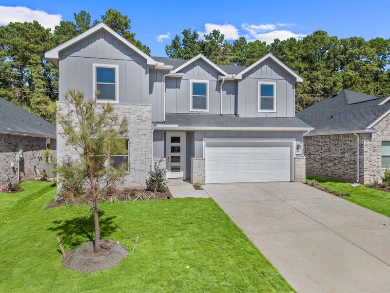 Front exterior of a new home in Westridge Cove, Conroe, TX, highlighting curb appeal (Image 16).